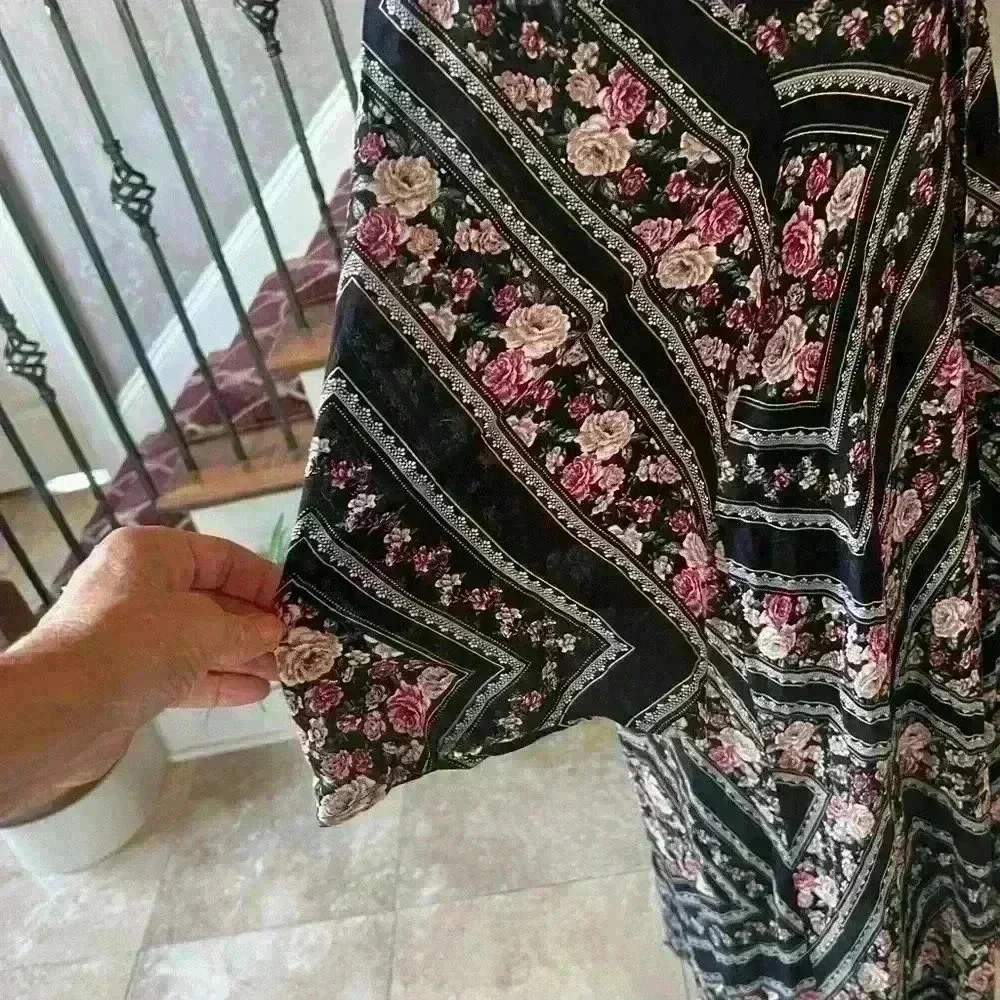 Torrid ladies maxi wrap size 1/2. Excellent condition. Floral black pattern maxi